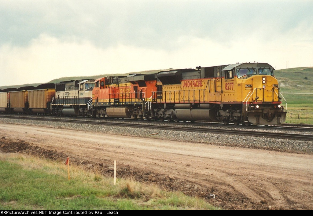 Loaded coal train rolls east